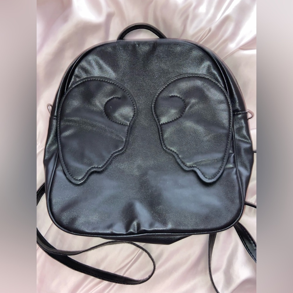 Black backpack with wings